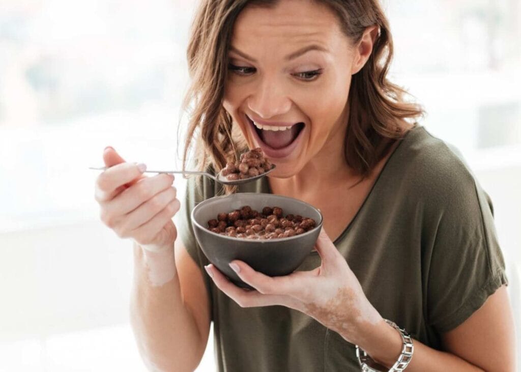 women eating coffee beans soaked in water