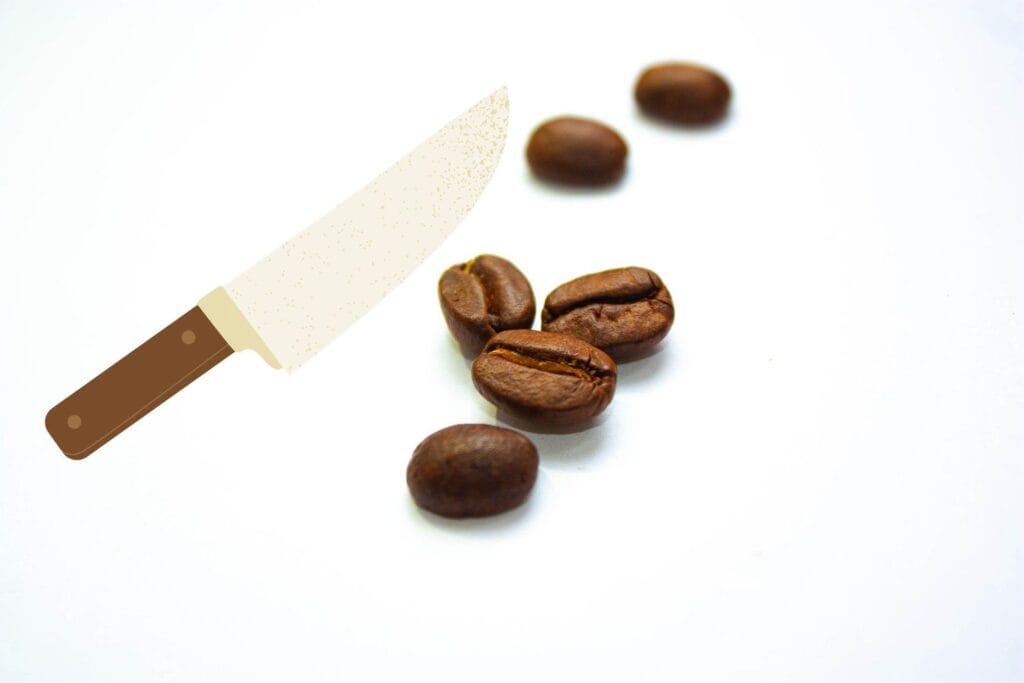 coffee beans under a knife
